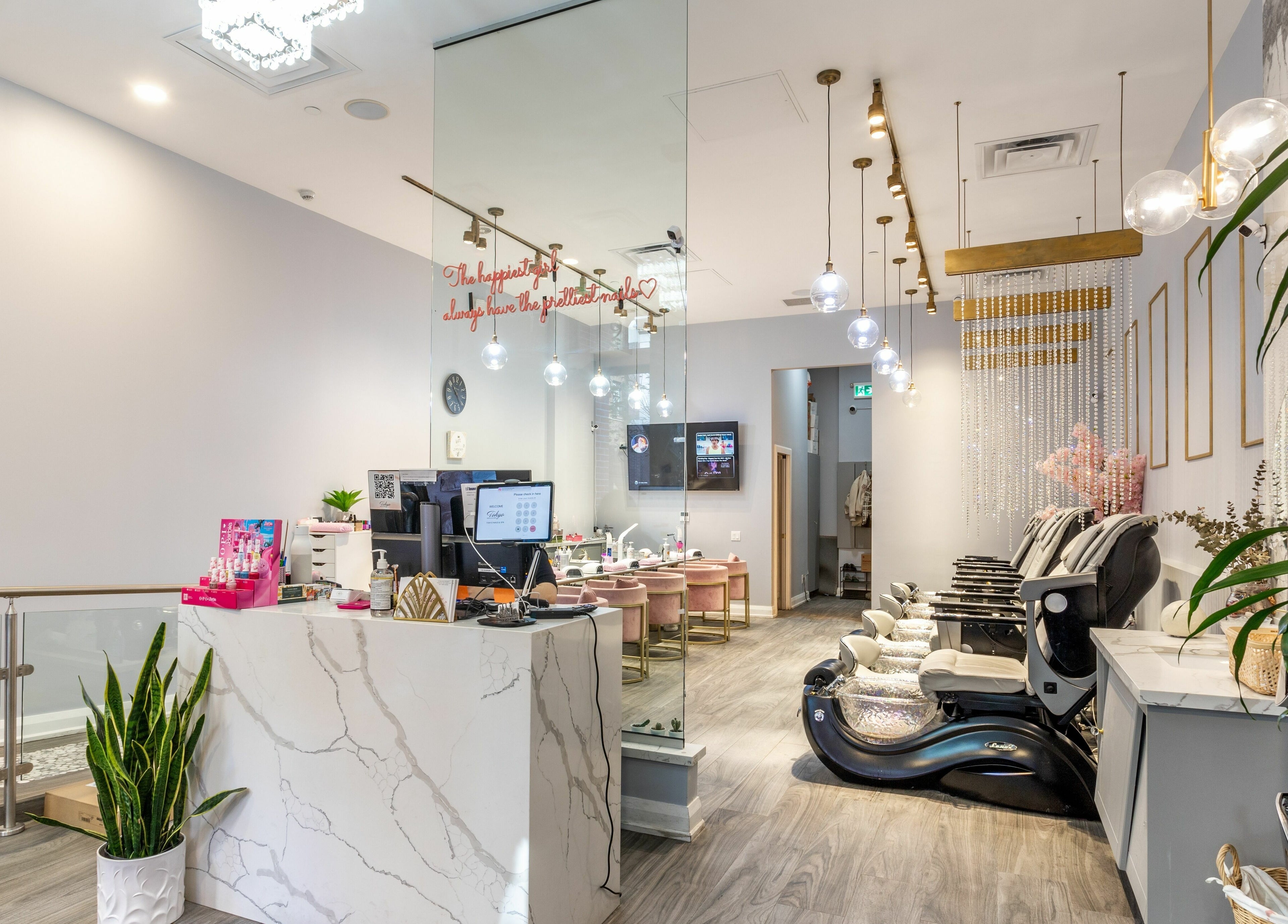 Elegant interior of Tokyo Nails and Spa in Toronto, Ontario, CA with luxurious pedicure chairs and modern decor.