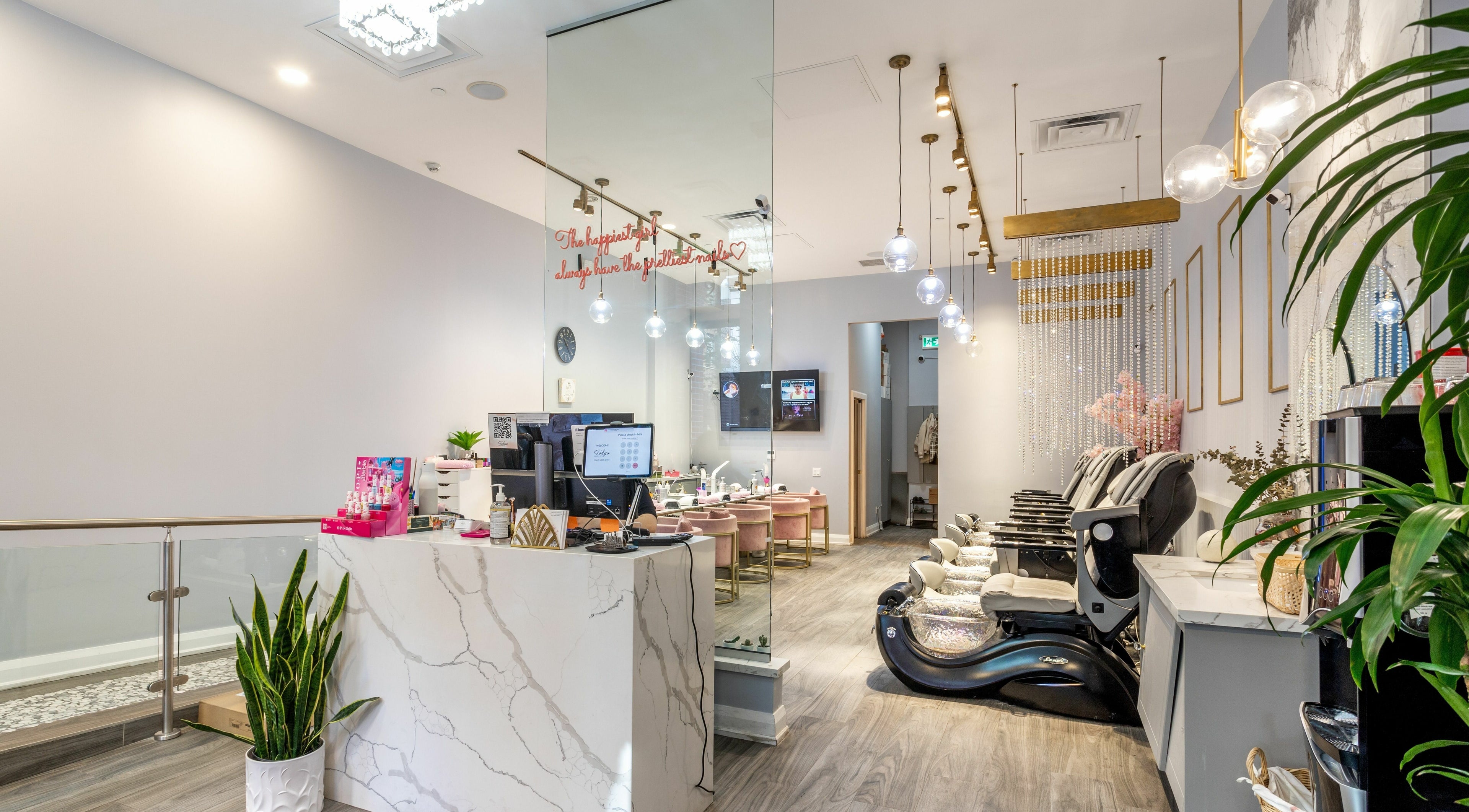 Elegant interior of Tokyo Nails and Spa in Toronto, Ontario, CA with luxurious pedicure chairs and modern decor.