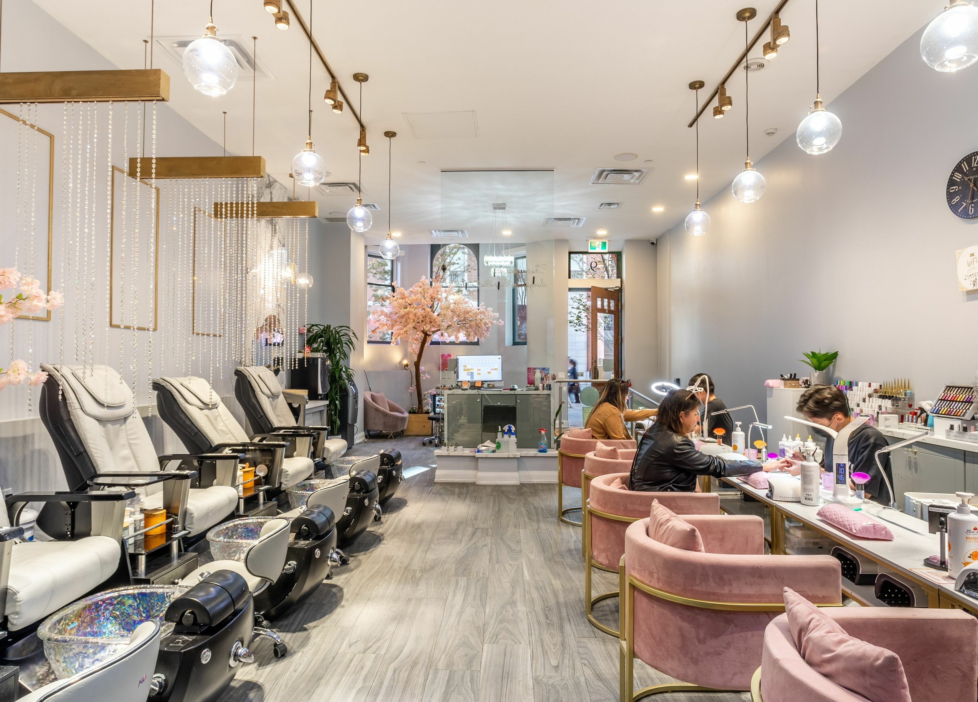 Interior of Tokyo Nails and Spa in Toronto, Ontario, CA, featuring luxurious pedicure chairs and modern decor.
