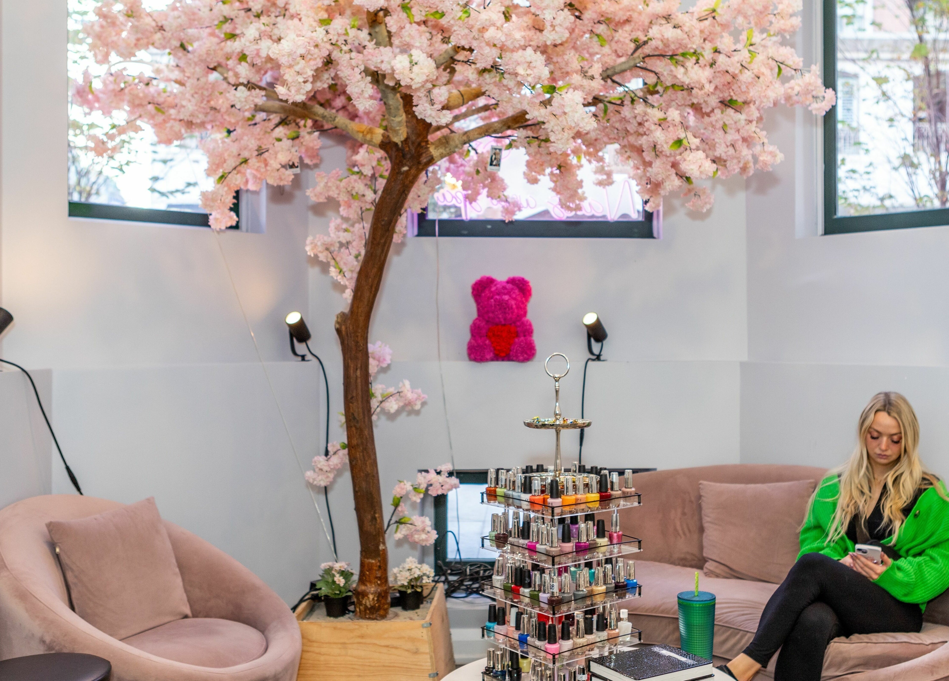 Relaxing nail spa at Tokyo Nails and Spa, Toronto, Ontario, CA, with cherry blossom decor and cozy seating.