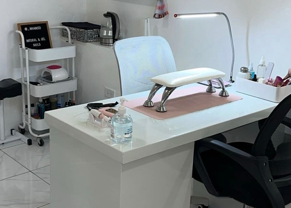 Nhanced nail station in Bridgetown, Saint Thomas, BB with sleek white decor and manicure tools.