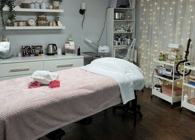 Relaxing treatment room at Bountiful Beauty Lounge, Bountiful, Utah, US, with cozy decor and warm lighting.