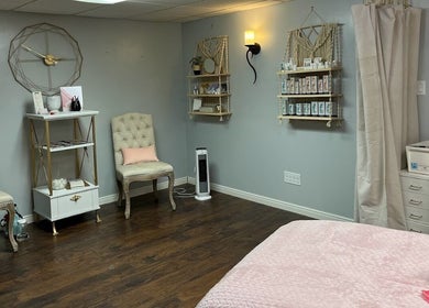 Elegant interior of Bountiful Beauty Lounge, featuring plush chairs and soft lighting in Bountiful, Utah, US.