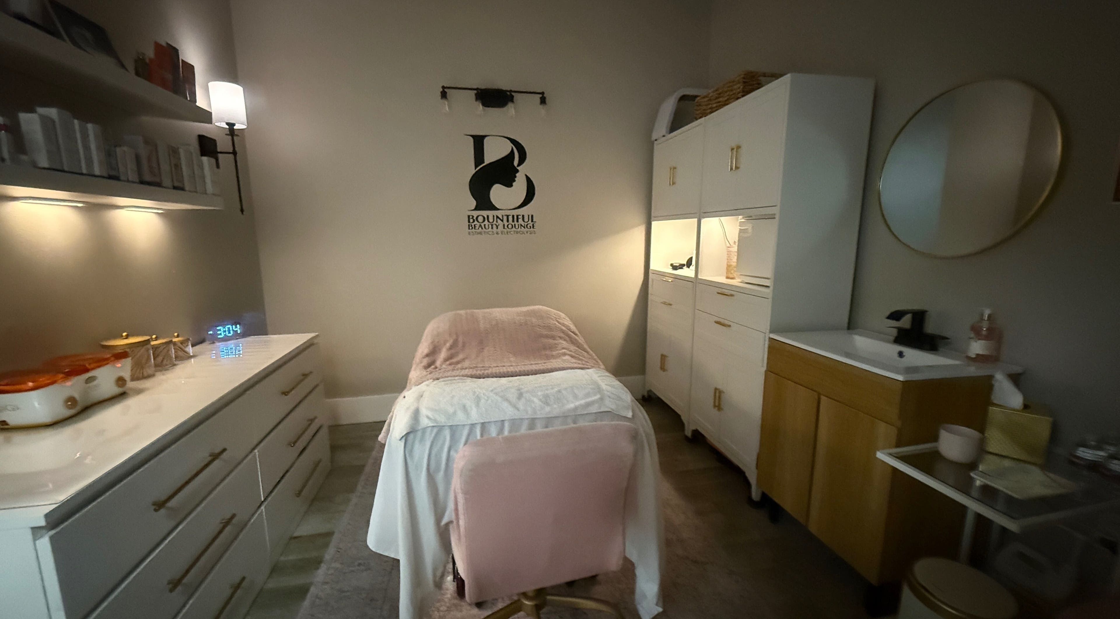 Relaxing treatment room at Bountiful Beauty Lounge in Bountiful, Utah, US with soft lighting and elegant decor.