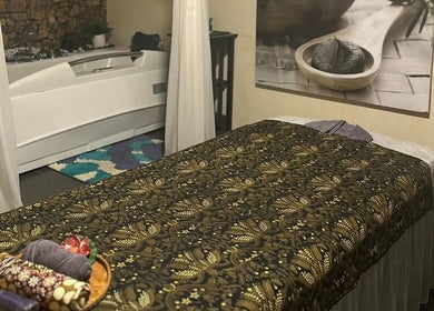 Treatment room at Tulip Spa and Beauty Seri Iskandar, Seri Iskandar, Perak, MY with a massage bed and tub.