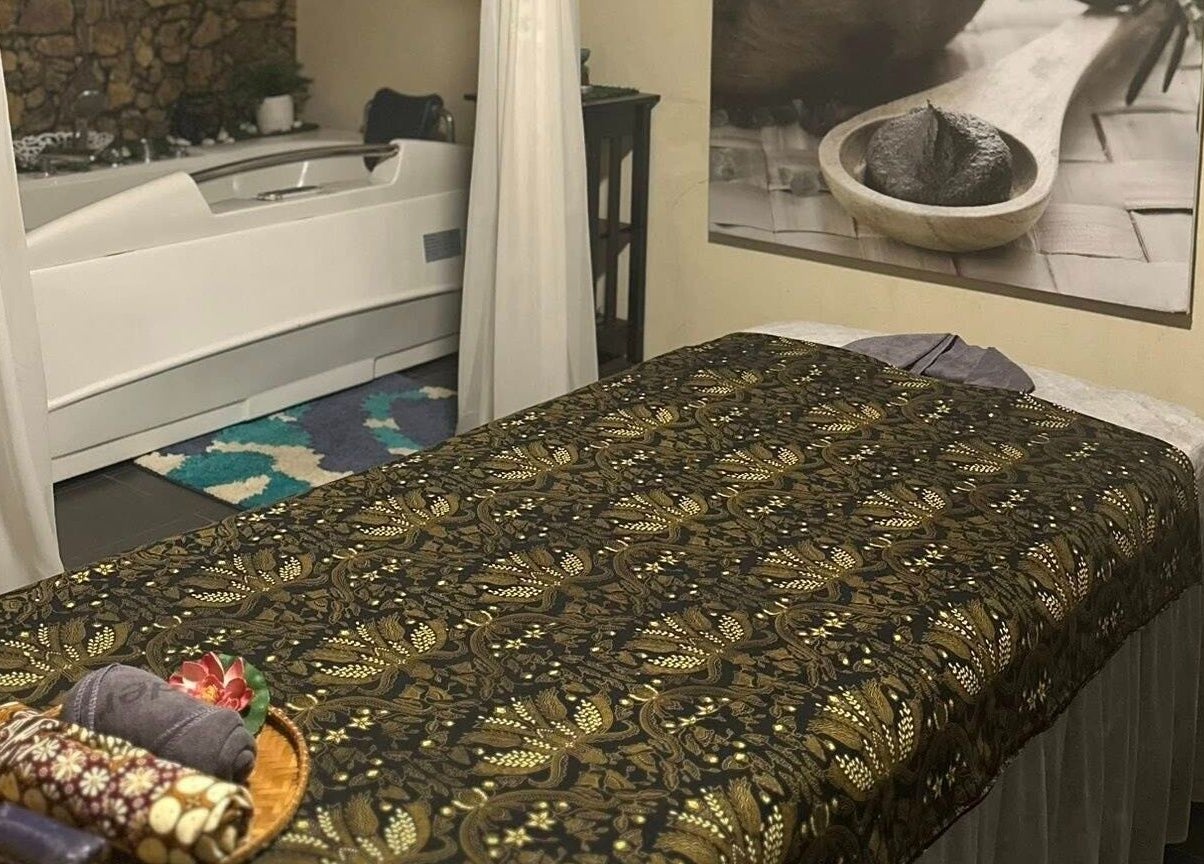 Treatment room at Tulip Spa and Beauty Seri Iskandar, Seri Iskandar, Perak, MY with a massage bed and tub.