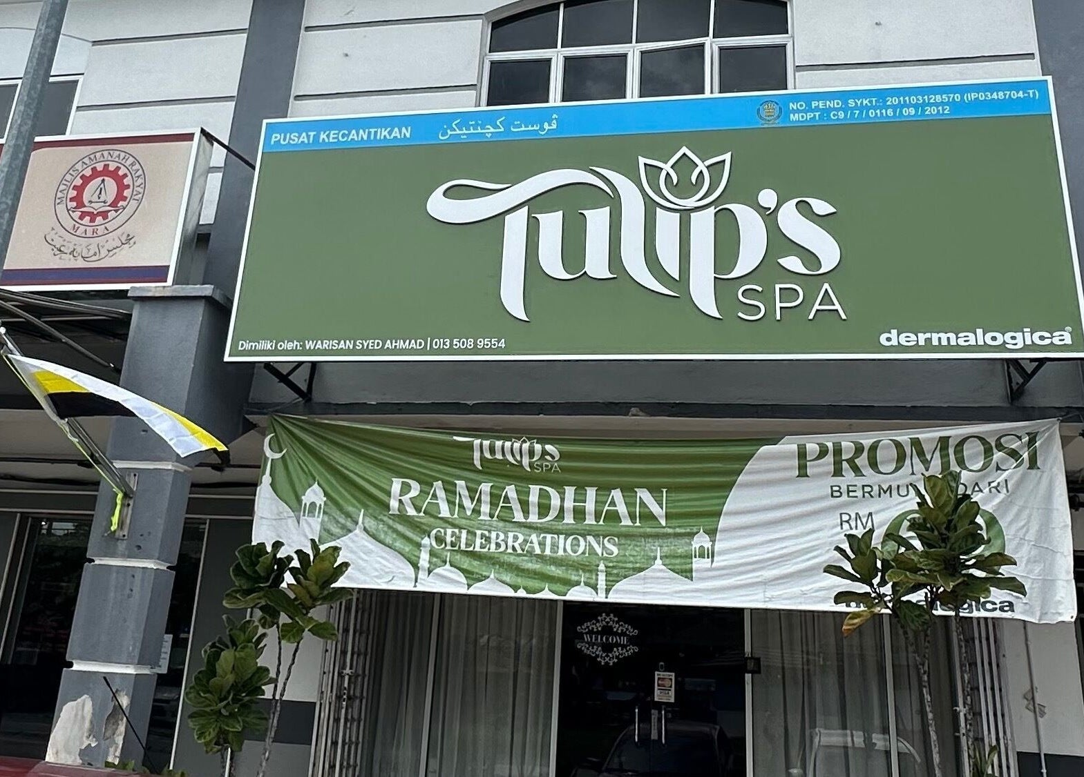 Front view of Tulip Spa and Beauty Seri Iskandar in Seri Iskandar, Perak, MY with green signage and festive banners.