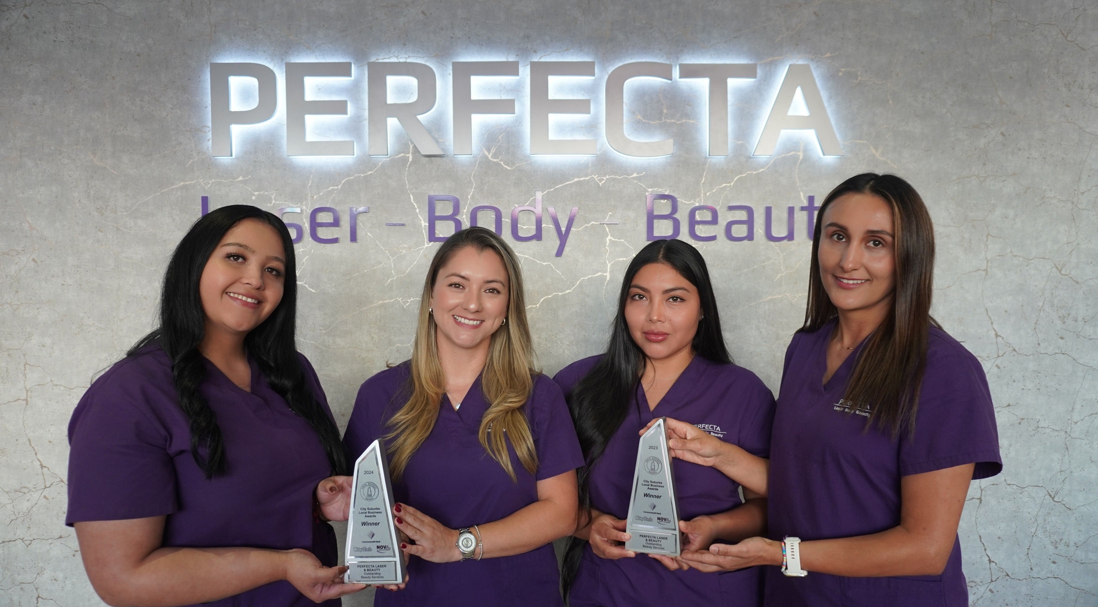 PERFECTA Laser - Body - Beauty Rockdale team holding awards in Rockdale, New South Wales, AU.