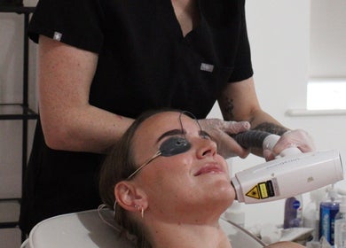 Laser treatment at SILKMUSE Laser & Skin in Uddingston, Scotland. A client enjoys rejuvenating skin care therapy.