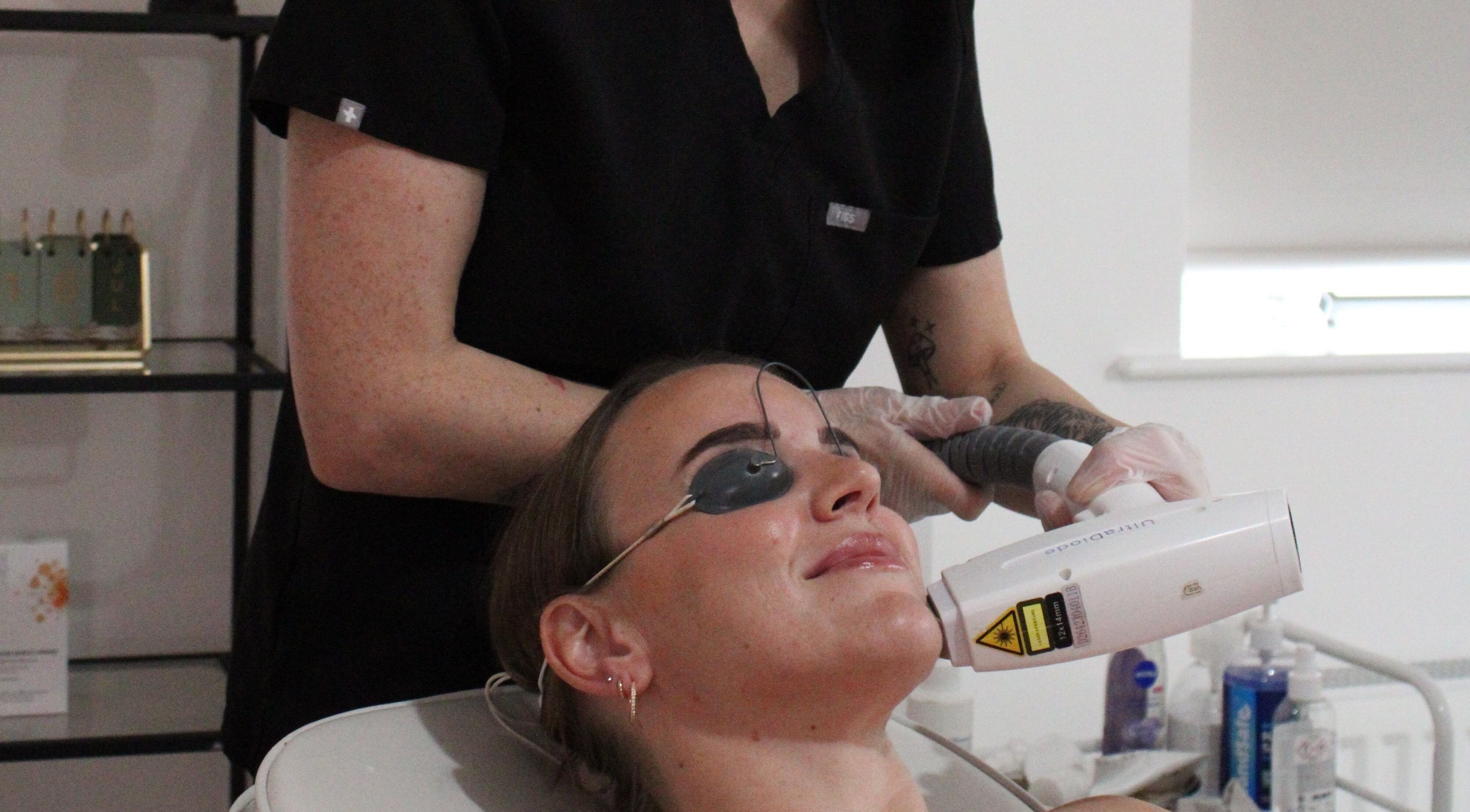 Laser treatment at SILKMUSE Laser & Skin in Uddingston, Scotland. A client enjoys rejuvenating skin care therapy.