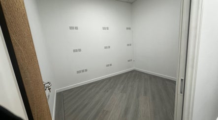 Modern empty room with wooden floor at Pixy Beauty, Stafford, England, GB.
