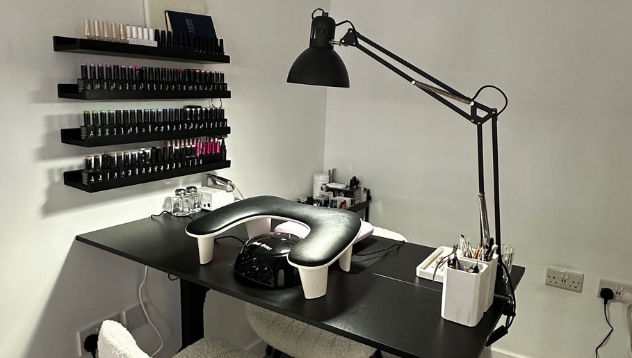 Modern nail station at Pixy Beauty in Stafford, England, GB, featuring sleek decor and organized nail polish display.