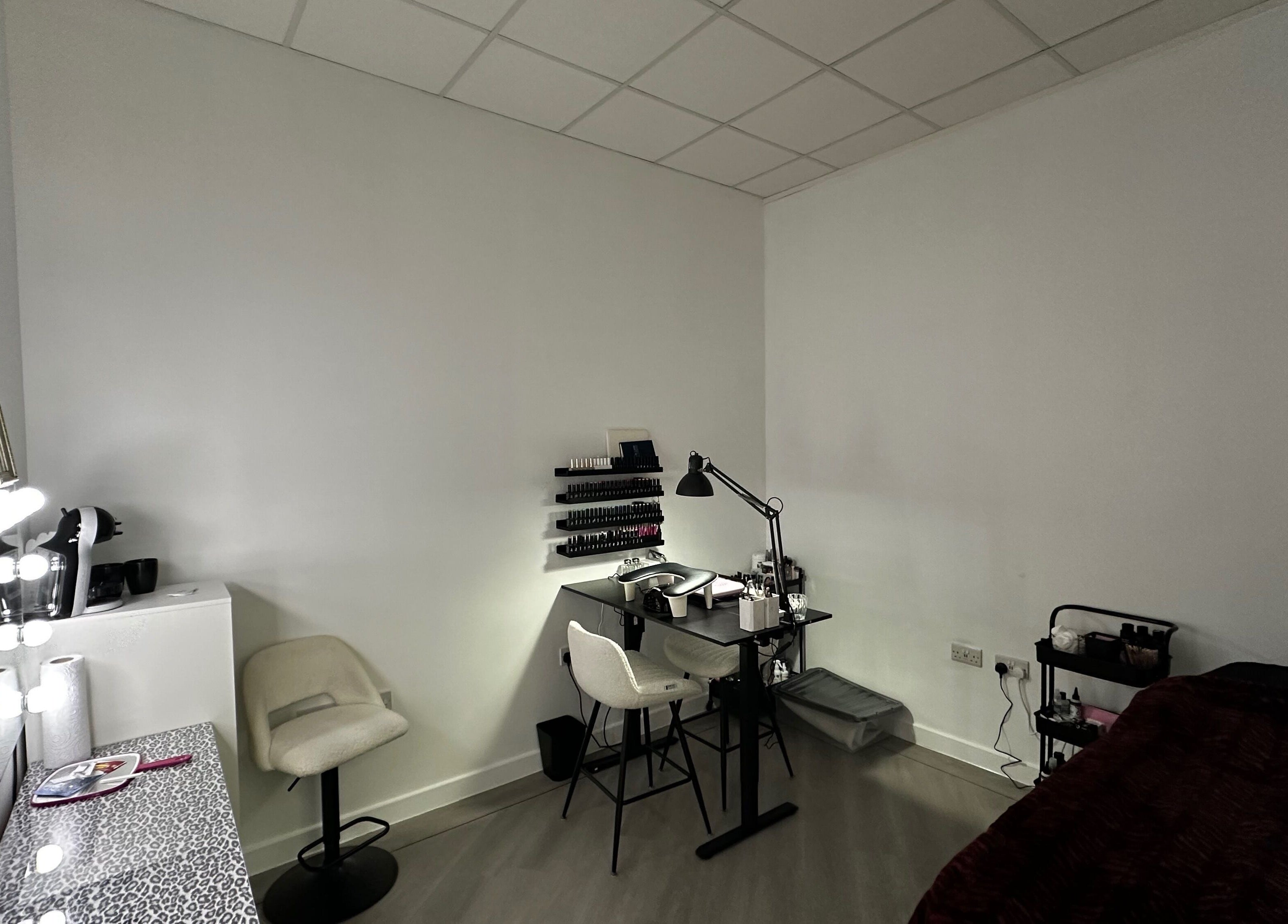 Modern beauty setup at Pixy Beauty, Stafford, England, GB featuring sleek furniture and nail polish display.