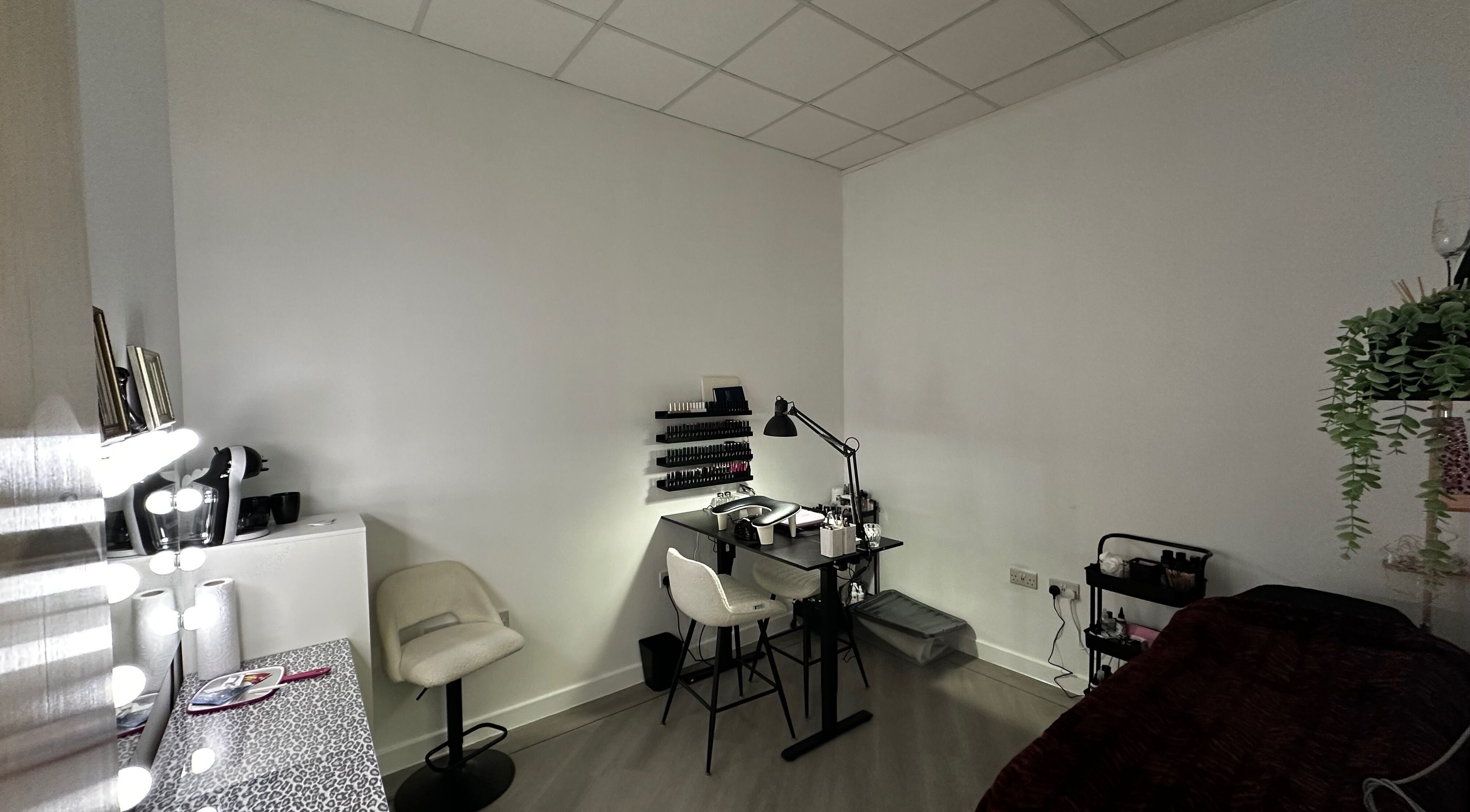 Modern beauty setup at Pixy Beauty, Stafford, England, GB featuring sleek furniture and nail polish display.