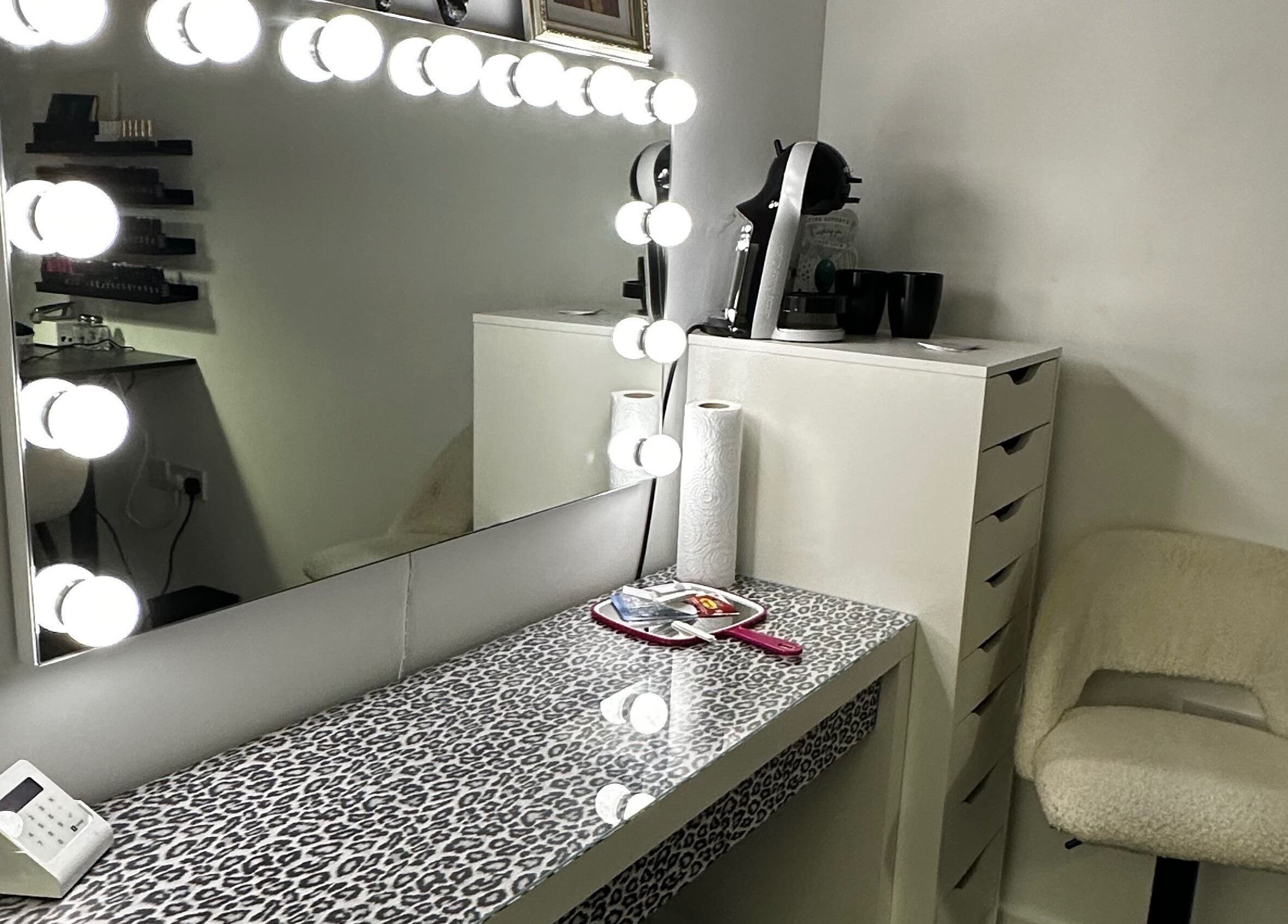 Modern vanity with lit mirror at Pixy Beauty, Stafford, England, GB. Perfect for beauty and wellness.