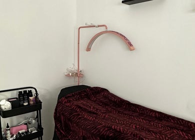 Comfortable treatment bed at Pixy Beauty, Stafford, England, GB, awaits clients for premium spa services.