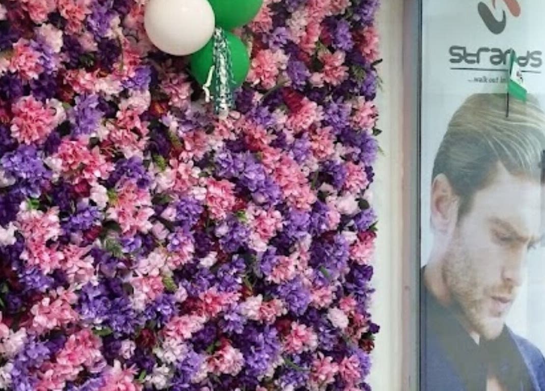 Floral wall display at Studio Strands in Lagos, Lagos, NG enhancing the venue's welcoming entrance.