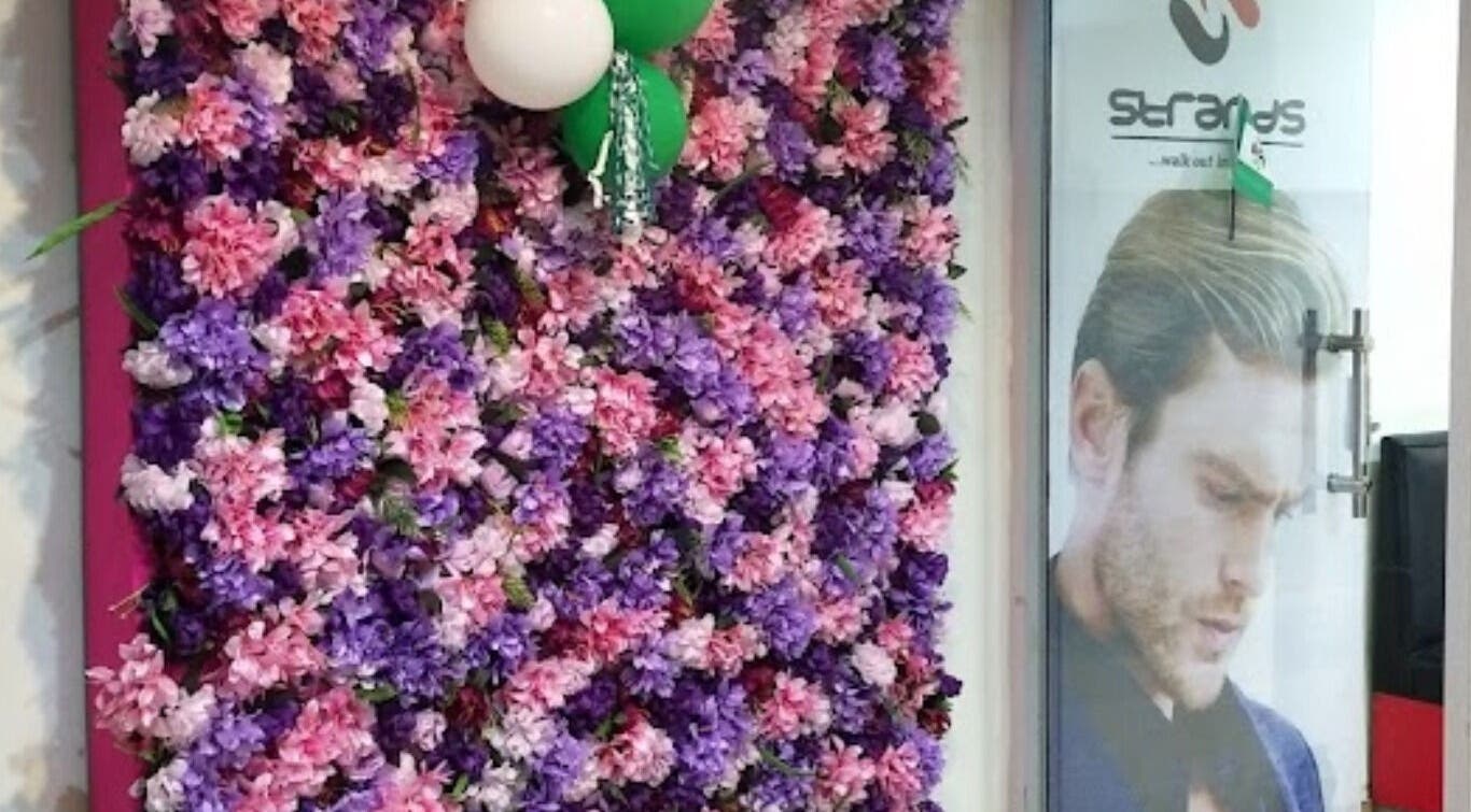 Floral wall display at Studio Strands in Lagos, Lagos, NG enhancing the venue's welcoming entrance.