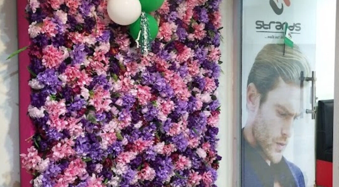 Floral wall display at Studio Strands in Lagos, Lagos, NG enhancing the venue's welcoming entrance.