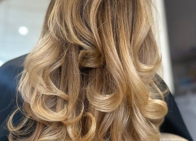 Beautifully styled blonde curls at Clare Elizabeth Colour & Styling Studio, Wirral, England, GB.