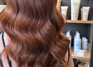 Beautiful wavy ginger hair styled at Clare Elizabeth Colour & Styling Studio, Wirral, England, GB.