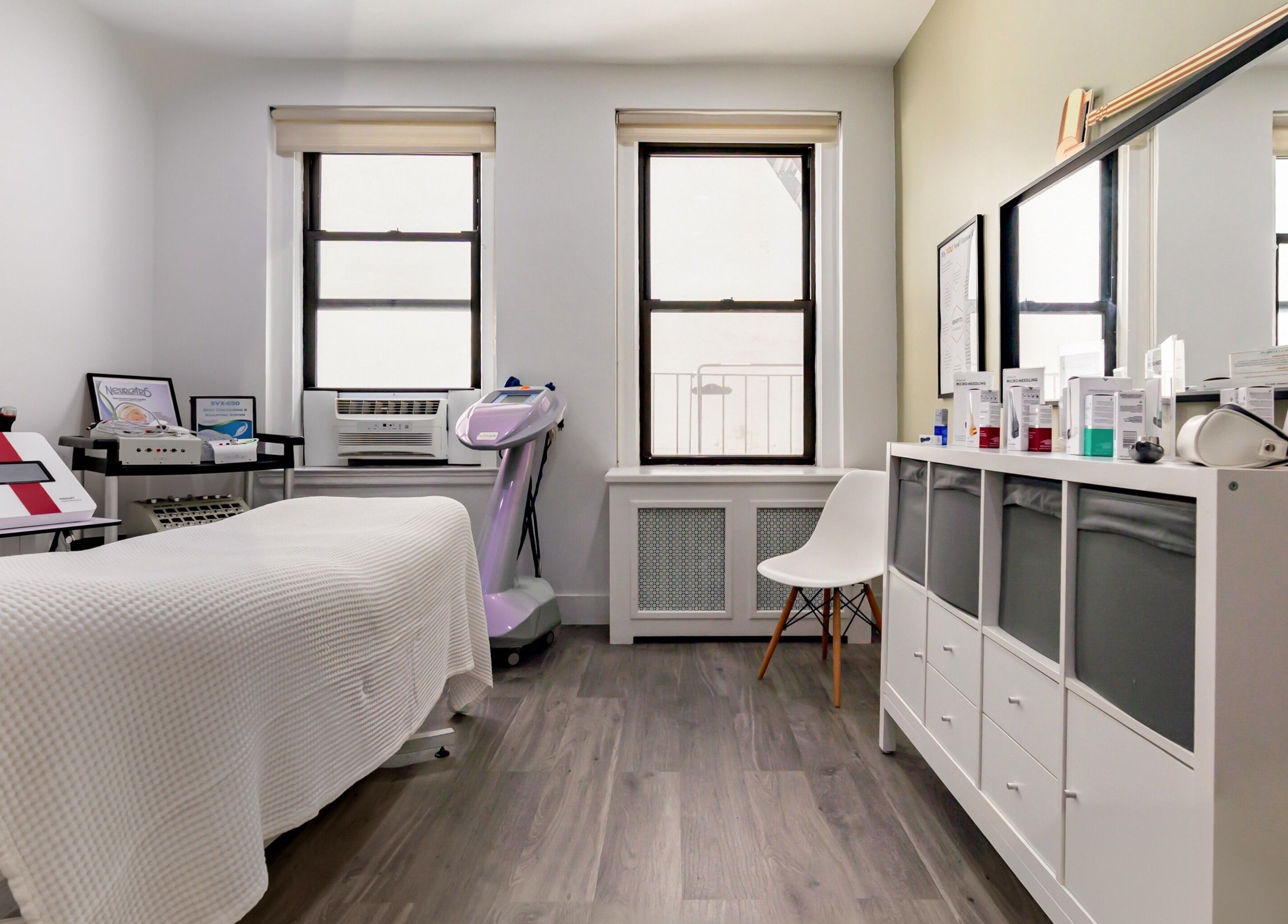 Cozy treatment room at The Renew Anti-Aging Center, New York, New York, US, with elegant decor and skincare equipment.