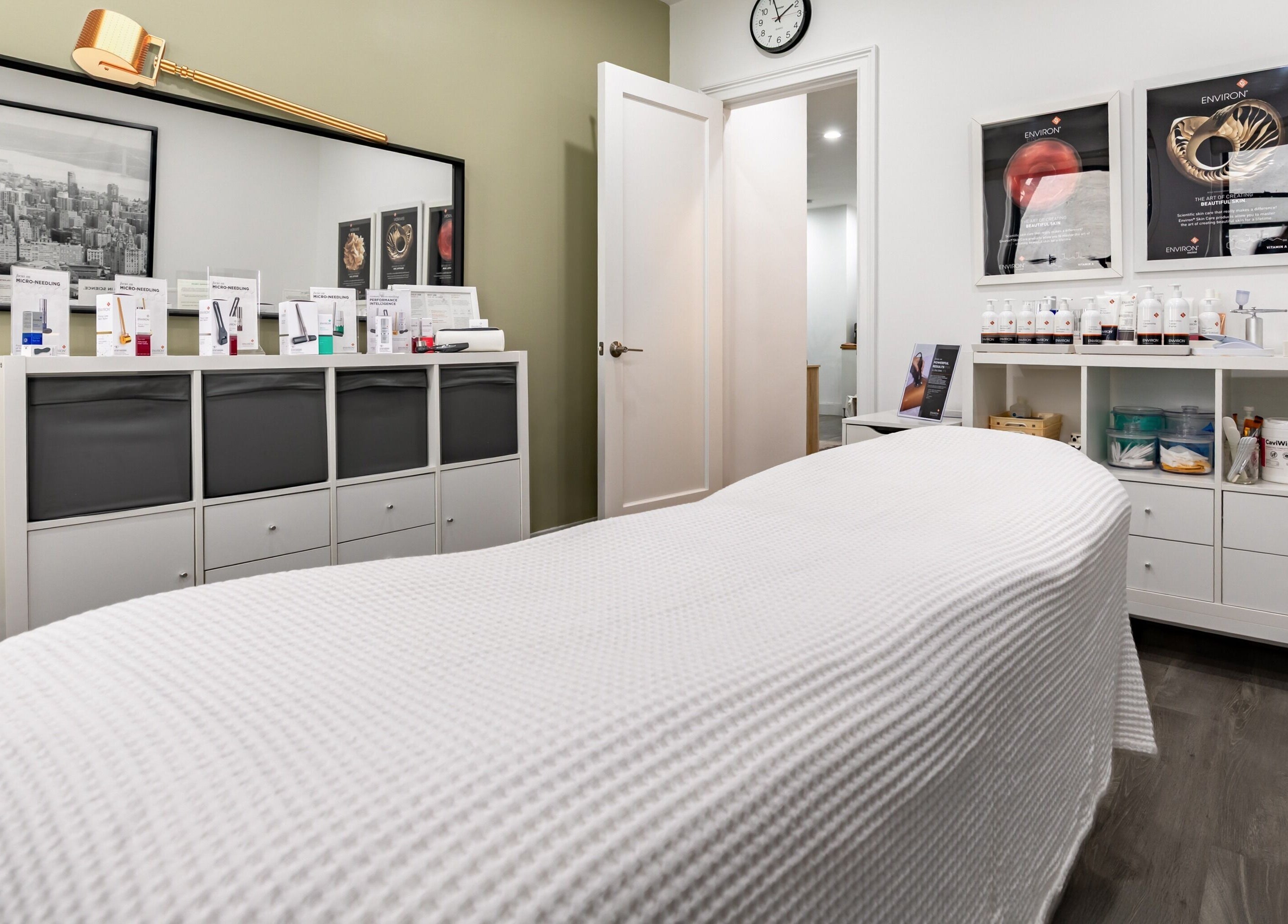 Calm treatment room at The Renew Anti-Aging Center, New York, New York, US, with skincare products displayed.