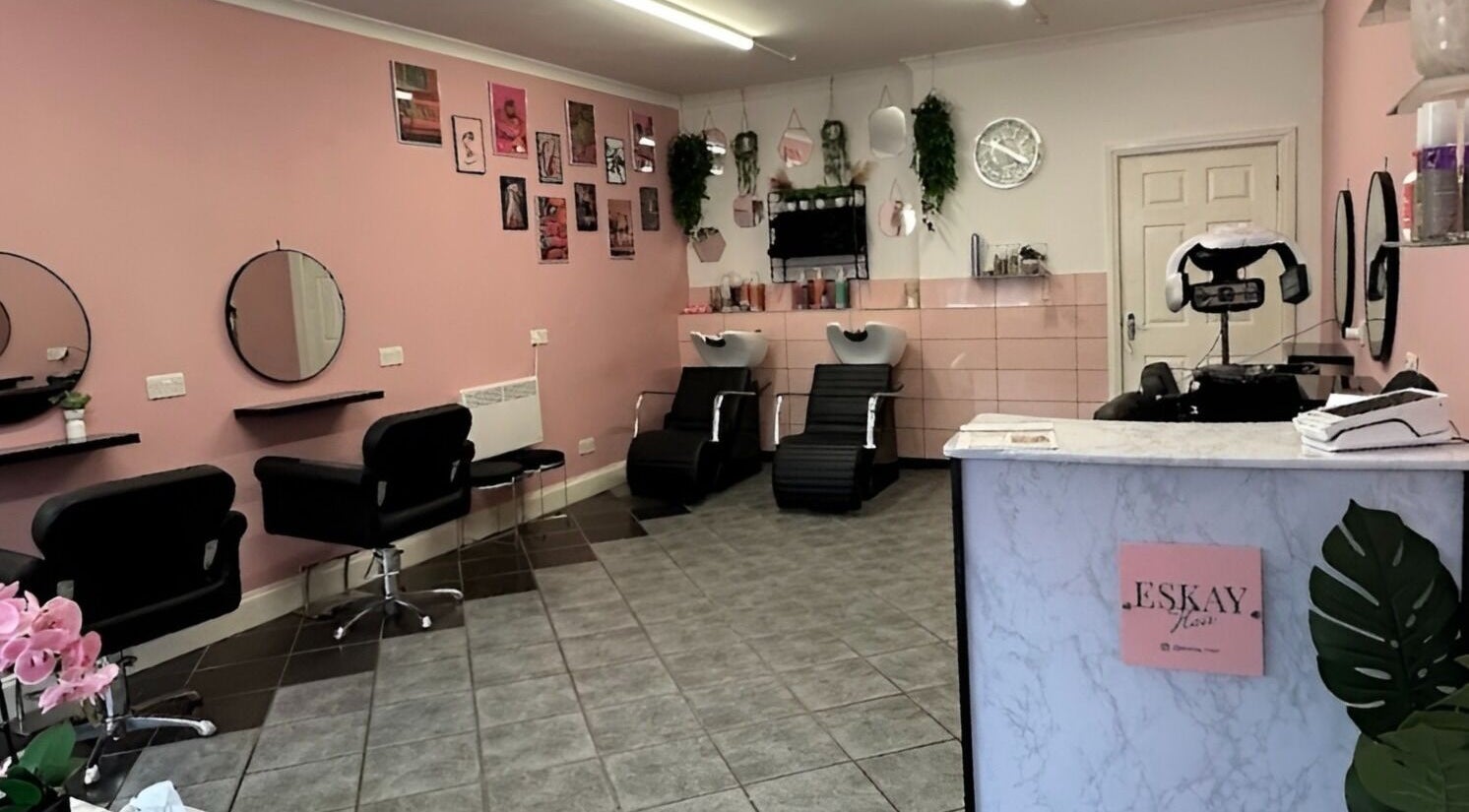 Stylish interior of Eskay Hair salon in Whittlesey, England, GB, featuring elegant chairs and modern decor.