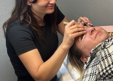 Expert applying eyelash extensions at Blush beauty studio, Henfield, England, GB.