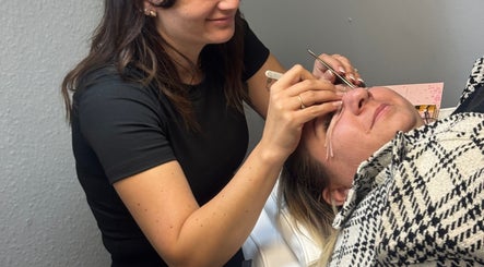 Expert applying eyelash extensions at Blush beauty studio, Henfield, England, GB.
