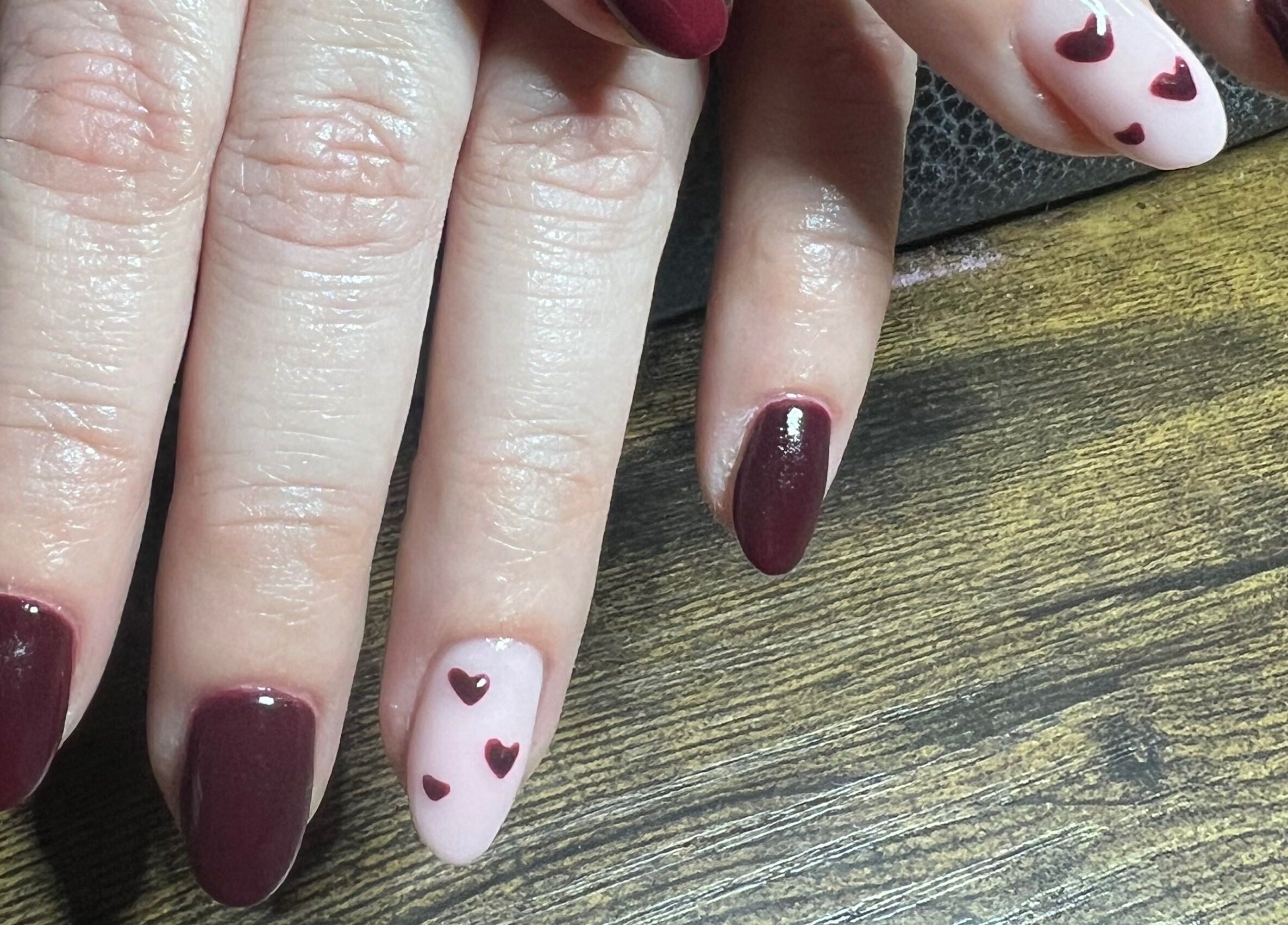 Elegant heart nail art at Blush Beauty Studio, Henfield, England, GB.