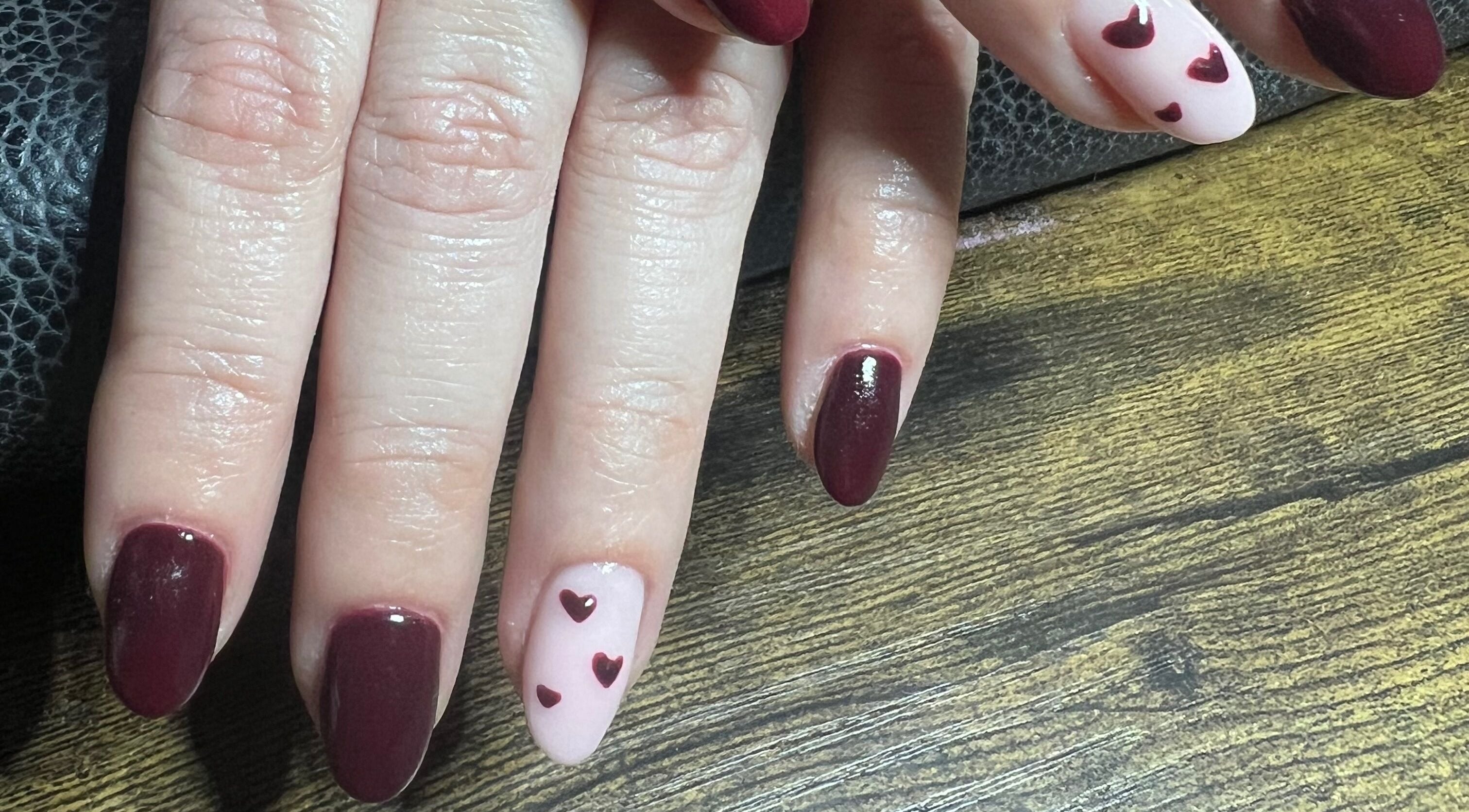 Elegant heart nail art at Blush Beauty Studio, Henfield, England, GB.