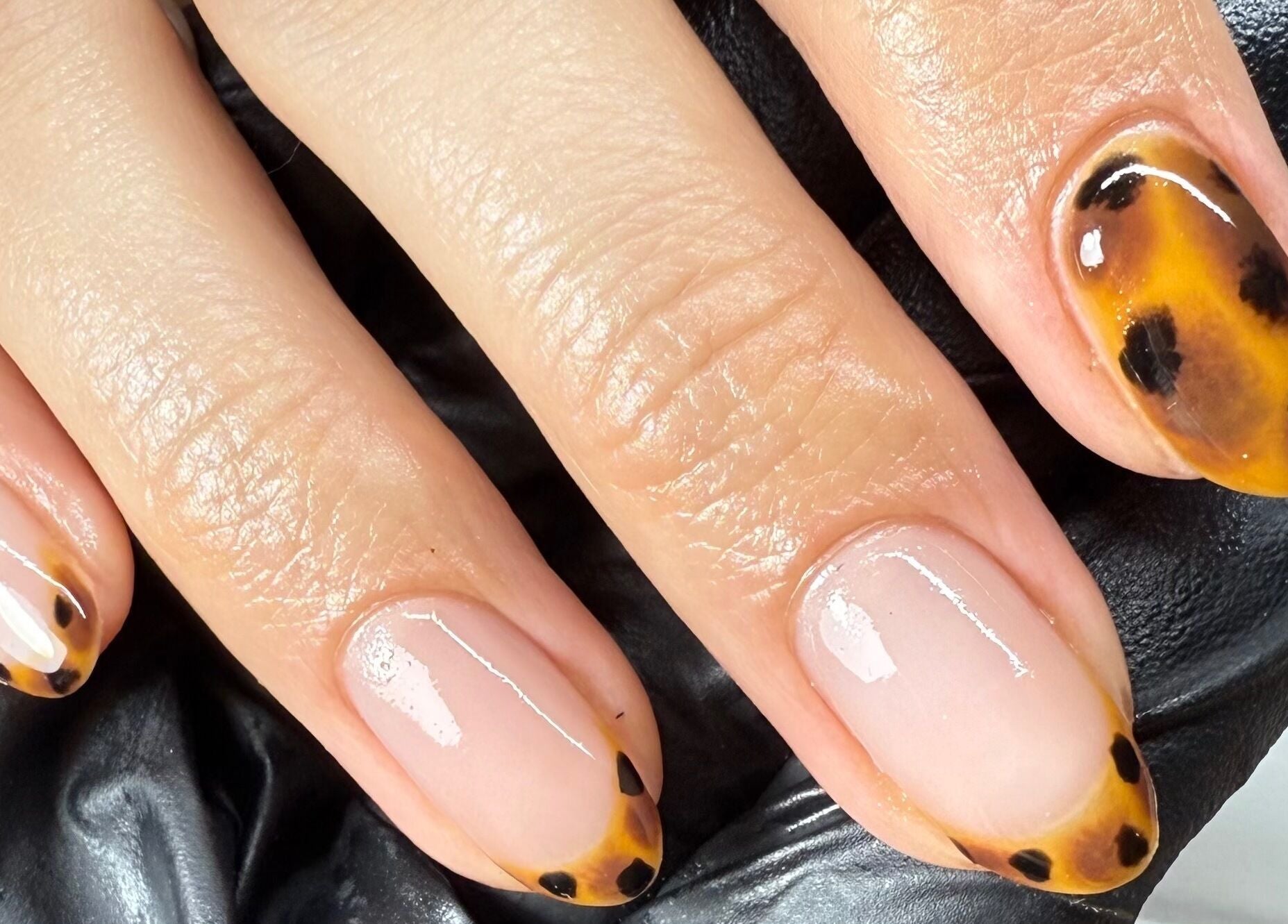 Leopard print nails by Nails by Tasha in North Hykeham, England, GB. Trendy nail art showcasing detailed hand design.