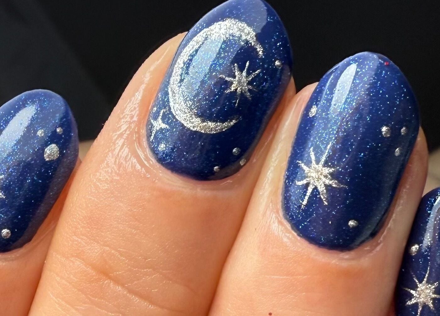 Starry night nail art at Nails by Tasha, North Hykeham, England, GB. Glittery blue nails with silver stars.