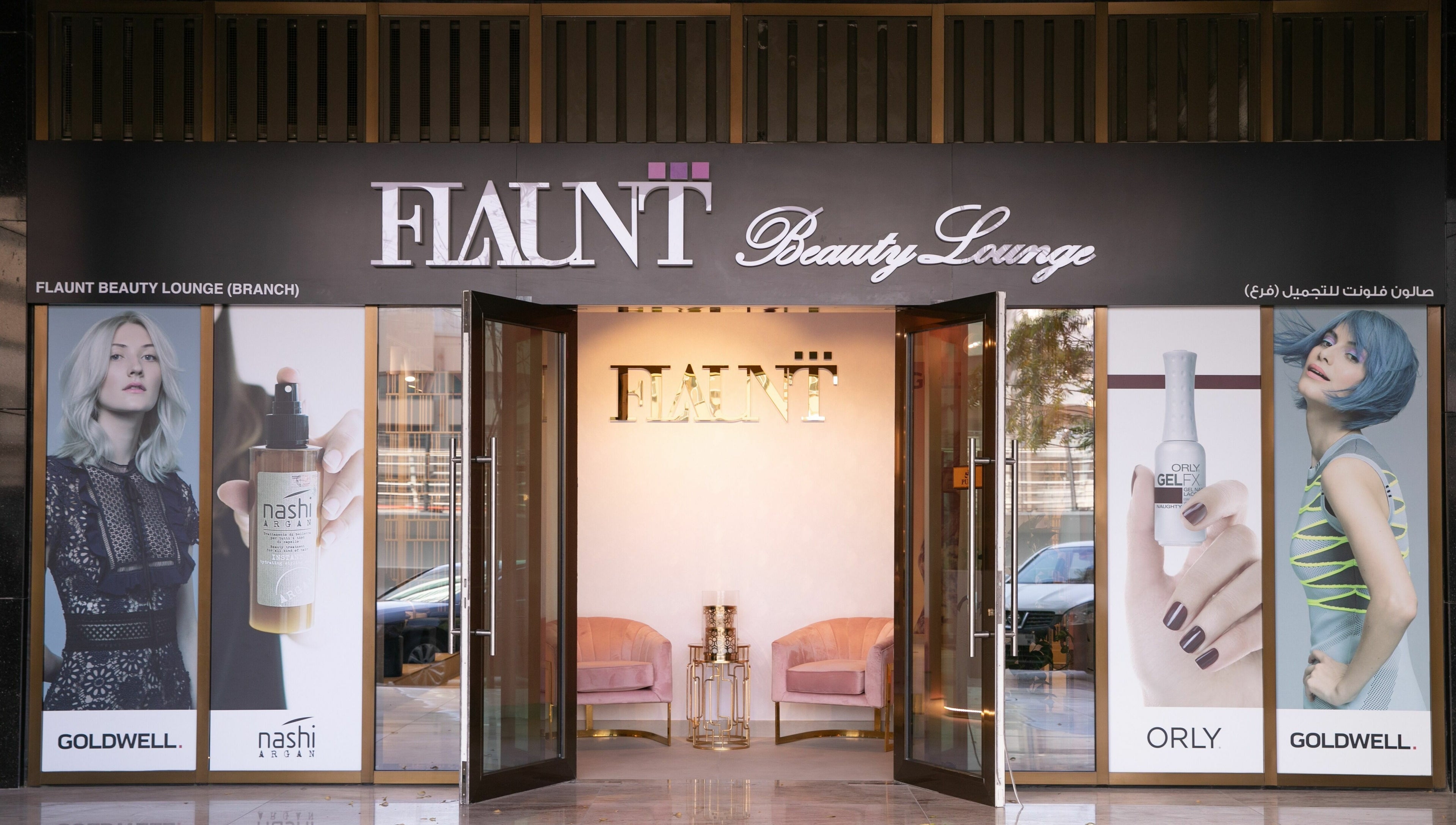 Front view of Flaunt Beauty Lounge in Dubai, Dubai, AE showcasing stylish posters and open glass doors.