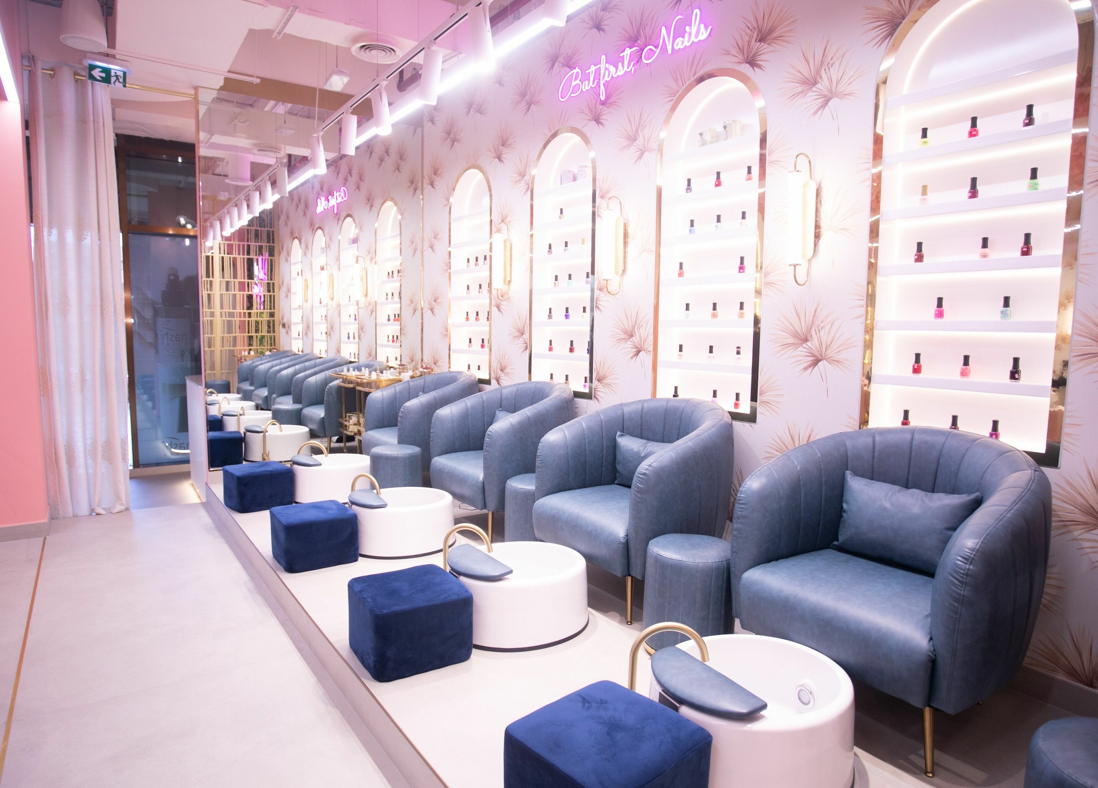 Elegant nail salon seating at Flaunt Beauty Lounge, Dubai, Dubai, AE with plush chairs and chic decor.