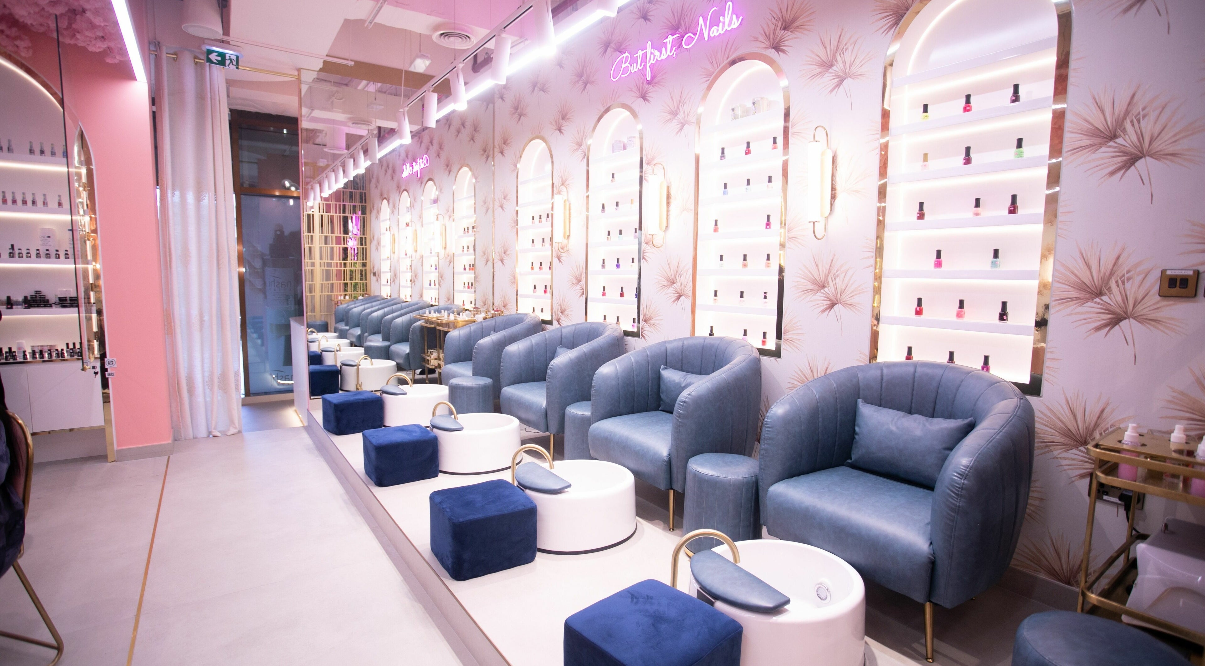Elegant nail salon seating at Flaunt Beauty Lounge, Dubai, Dubai, AE with plush chairs and chic decor.