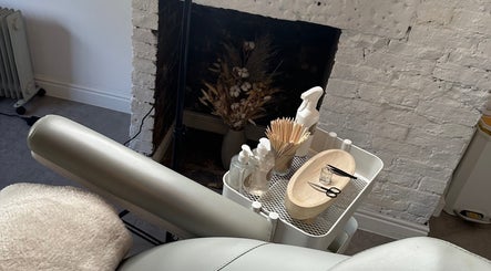 Relaxing treatment setup at RS Artistry, S18 Face Clinic, Dronfield, England, GB with tools and a comfy chair.