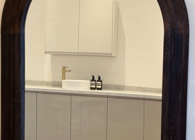 Elegant mirror view at RS Artistry, Dronfield, England, GB showcasing modern sink and cabinetry.