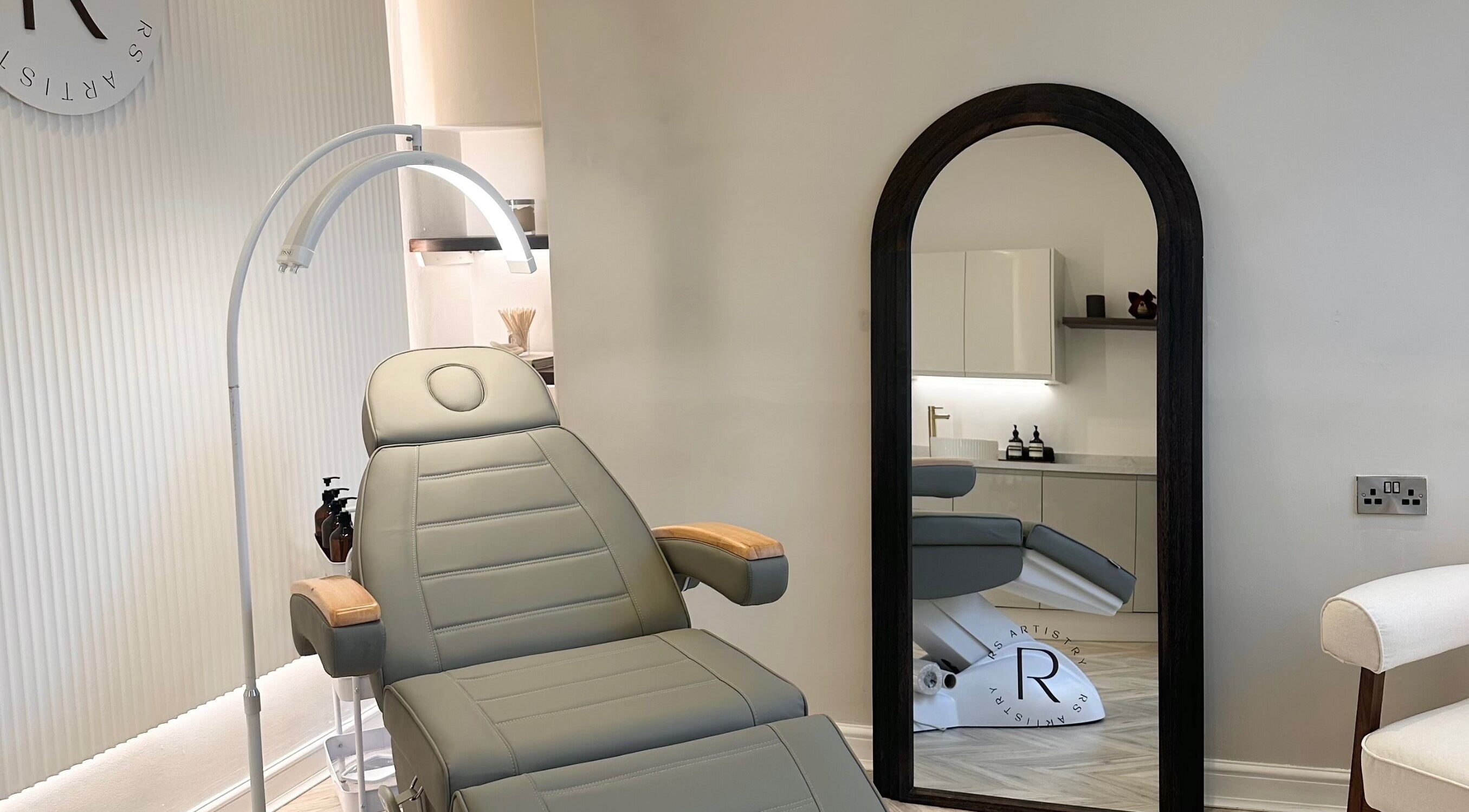Luxurious treatment room at RS Artistry, Dronfield, England, GB with modern design and comfortable chair.