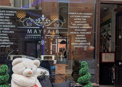 Entrance of Mayfair Aesthetics and Beauty featuring a welcoming bear in London, England, GB.