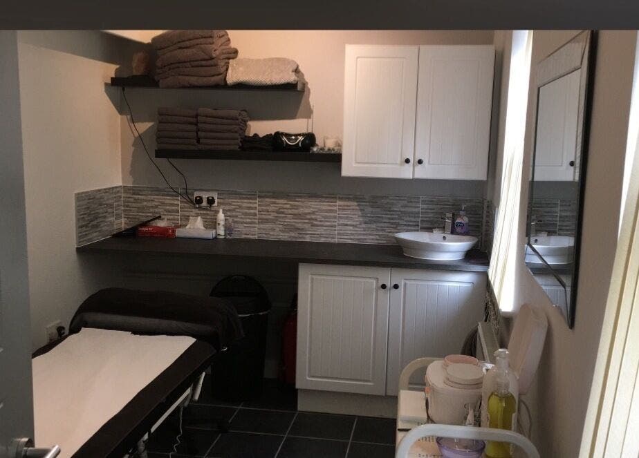 Cozy treatment room at Beauty by Calandra, Birmingham, England, GB, featuring soothing decor and spa essentials.