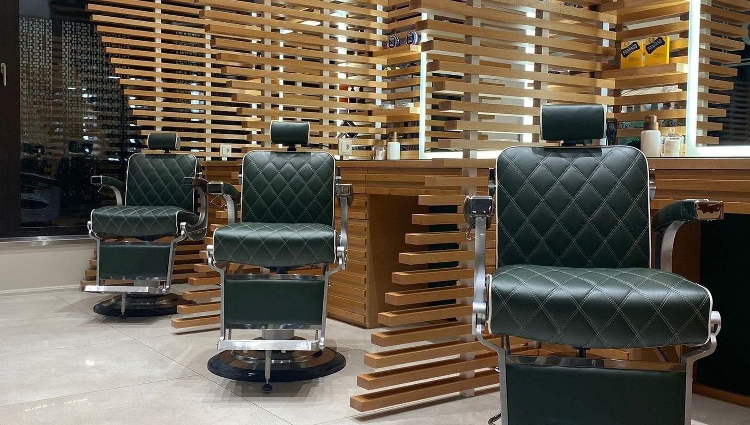 Luxurious barber chairs at The Good Barbers - Enge in Zürich, Zürich, CH, await customers in a modern setting.