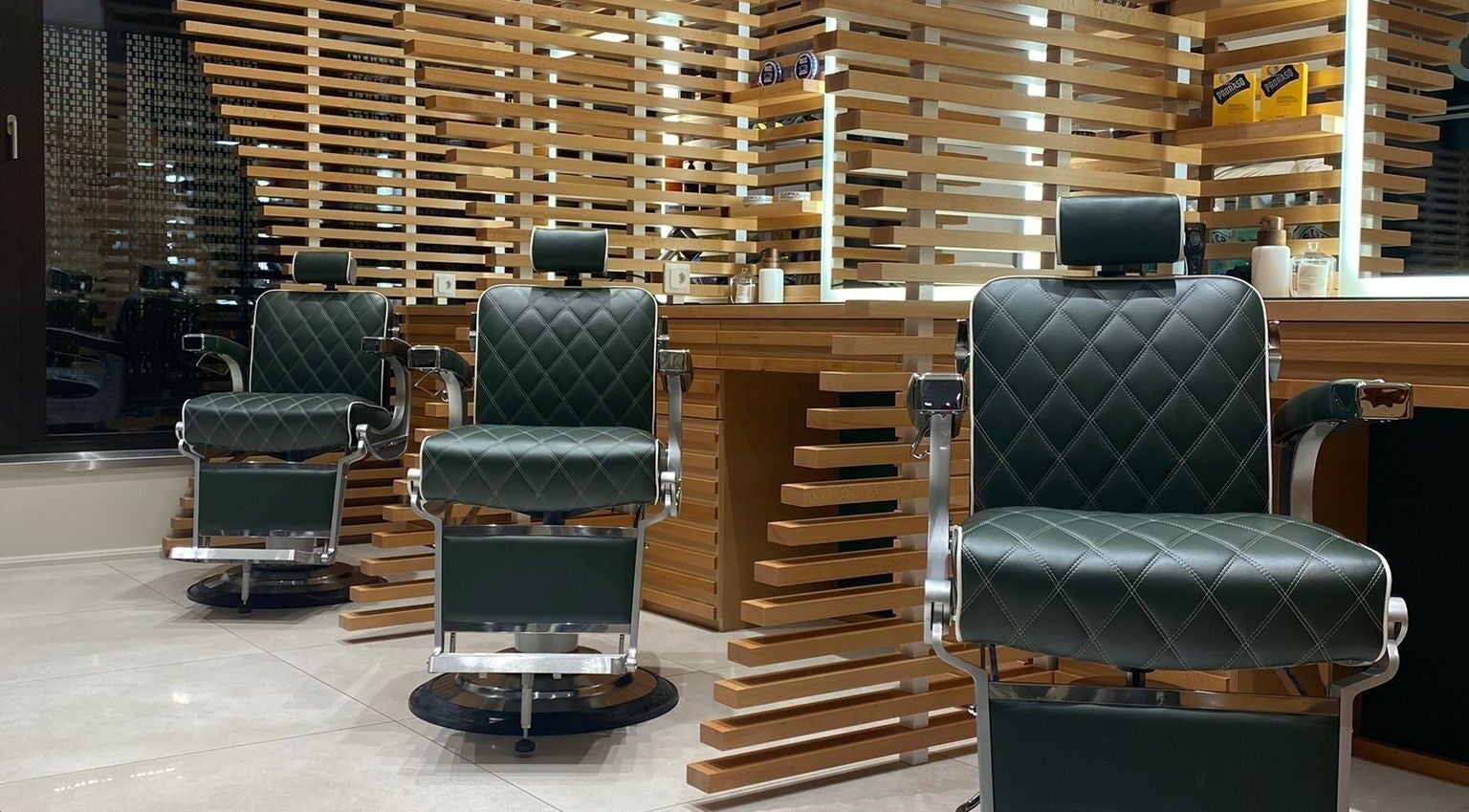 Luxurious barber chairs at The Good Barbers - Enge in Zürich, Zürich, CH, await customers in a modern setting.