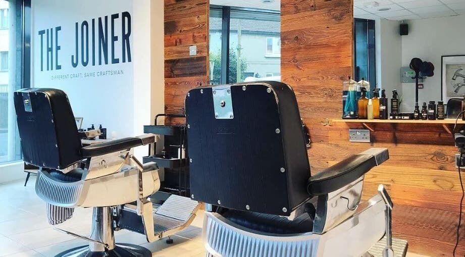 Interior view of The Joinery Barbershop in Blackrock, County Dublin, IE, featuring modern barber chairs.