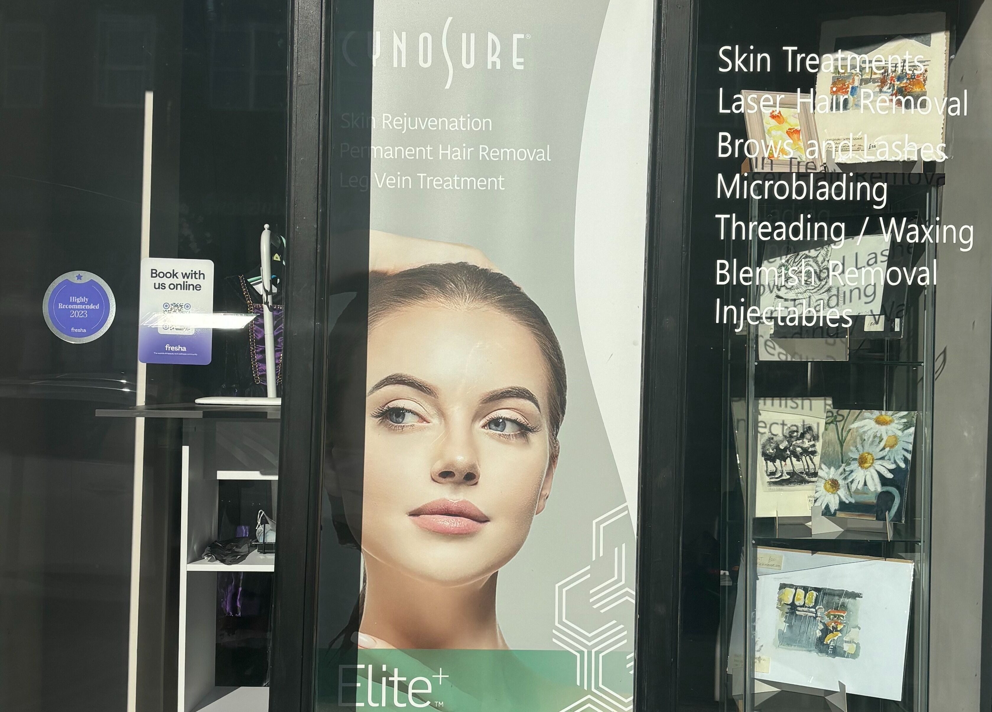 Front window of Therabeautic in Potters Bar, England, GB showcasing beauty treatments and services.