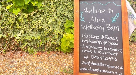 Chalkboard at Alma Wellbeing Barn in Bourn, England, GB welcomes visitors with massage and yoga services.