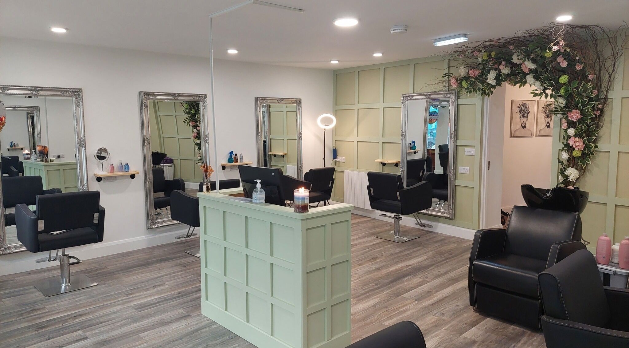 Chic interior of Carpe Diem Hair Salon, County Galway, IE, featuring ornate mirrors and floral decor.