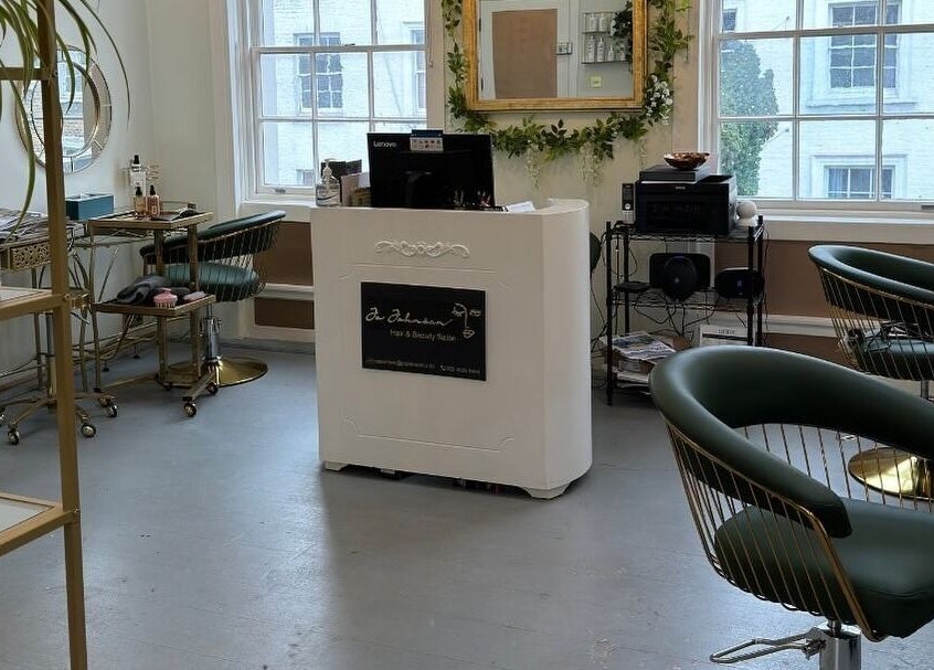 Jo Johnson Salon in London, England, GB offers a chic, inviting space with modern decor and comfortable seating.