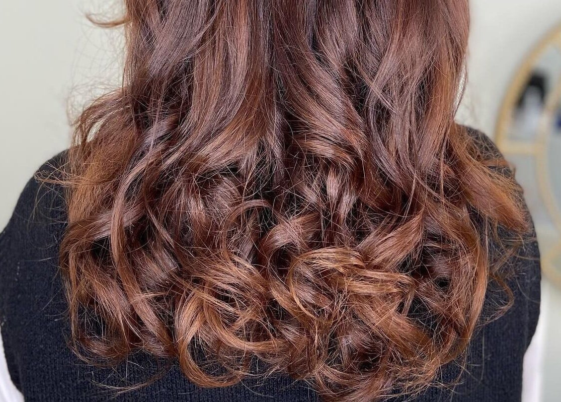 Beautiful curly hairstyle from Jo Johnson Salon, London, England, GB. Perfect glossy and vibrant hair styling.